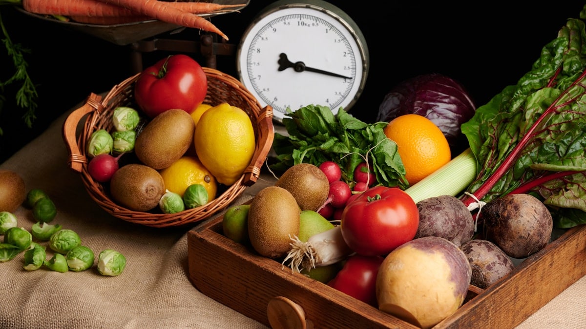 a wooden box filled with lots of different types of vegetables